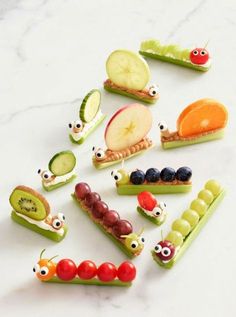 many different fruits and vegetables are arranged in the shape of caterpillars with eyes on them