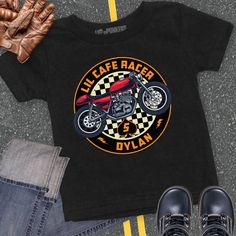 a black shirt with an image of a motorcycle on it