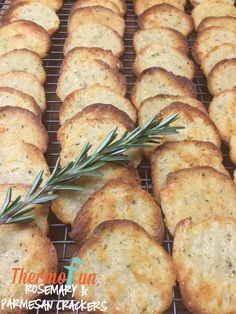 crackers with rosemary sprigs on a cooling rack