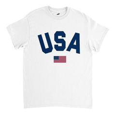 "Premium heavy cotton classic fit T-shirt with a great and letter graphic (\"USA\") and the flag of the United States of America on the front. Comfortable shirt for both men and women. Relaxed and regular fit. This versatile shirt is perfect for various occasions, whether you're attending a 4th of July celebration, supporting your favorite sports team or simply wanting to exhibit your love for the USA. Very nice gift idea for people whose heart truly lies for the USA - the land of the free and the home of the brave! Designed with ❤️ in California (USA)/England (UK) and produced fairly. Fabric details .: Heavy fabric (5.3 oz/yd² (180 g/m .: Solid colors are 100% cotton .: Seamless double-needle collar .: Double-needle sleeve and bottom hems .: 100% combed and ring-spun cotton .: Taped neck White T-shirt With American Flag For Independence Day, White American Flag T-shirt For Independence Day, American Style Pre-shrunk Cotton T-shirt, White Cotton T-shirt With American Flag Print, American Flag Cotton T-shirt For Streetwear, Flag Print Crew Neck Tops For Sports Events, 4th Of July Streetwear T-shirt With Letter Print, Veterans Day Cotton Shirt With Flag Print, Independence Day Streetwear T-shirt Crew Neck