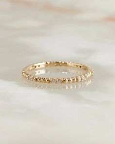 The Beaded Diamond Stud Band – Après Jewelry Gold Moissanite Ring, Diamond Stacking Rings, Solid Gold Band, Half Eternity Band, Gold Ring Stack, Moissanite Wedding Bands, Platinum Metal, Ring Sizer, Eternity Band Diamond