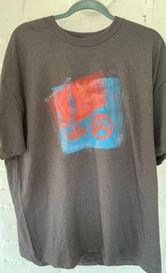 Check out these hand made anarchy t-shirts? How cute! Screen print fabric ink, heat set on gif ha quality Hanes Beefy shirts. Dark grey. Images and colors vary slightly! Can be washed and dried as normal  Only one M, L, and XL currently available. Don't see your size? Send me a DM and I'll make ya one 🤗 Anarchy Shirt, Punk Shirt, Screen Printed Fabric, Print Fabric, Screen Print, Etsy Australia, Dark Grey, Screen Printing, Gender Neutral