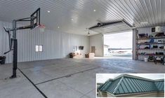 an empty garage with a basketball hoop in the middle