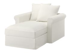 a white chair with two pillows on it