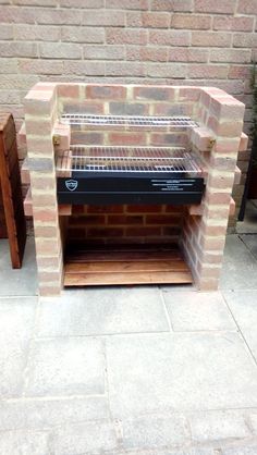 a brick oven sitting on top of a patio