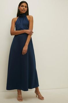 This navy satin midi dress with a high halterneck is the perfect choice for any special occasion. Whether you're a bridesmaid or attending a formal event, this dress will make you look and feel elegant. The midi length adds a touch of sophistication, while the halterneck design adds a modern twist. Halter Neck Midi Dress, Womens Bridesmaid Dresses, Bridesmaid Dress Collection, Dresses Satin, White Halter Dress, Oasis Dress, Dresses Australia, Dark Blue Dress, Maxi Bridesmaid Dresses