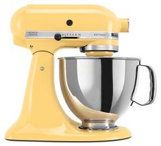 a yellow kitchen mixer on a white background