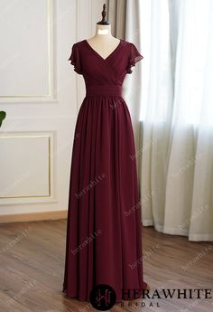 Modest chiffon bridesmaid formal dress featuring a slight V criss cross pleated bodice with floating cap sleeves and full back with zipper and a slightly gathered skirt. Color: custom Fabric: chiffon Silhouette: a line Length: floor length Cap Sleeve Back Style: zipper Fully lined Built-in bra