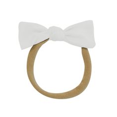 Add a touch of sweetness to your little one’s look with this easy-to-wear, knotted bow that keeps them feeling comfortable and looking cute. A soft, stretchy band made from nylon is super gentle on baby-fine hair and stays in place, no matter how much your little one crawls, rolls, or runs throughout the day. Nylon band 2.5” knotted bow Womens Matching Sets, Adult Blanket, Bag Hanger, Toddler Blanket, Holiday Baby, Sock Shop, Bamboo Fabric, Pet Bandana, Family Outfits