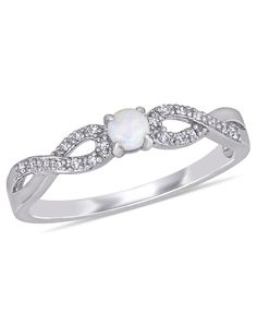 a white gold ring with an opal and diamond accenting the band, set in 18k white gold