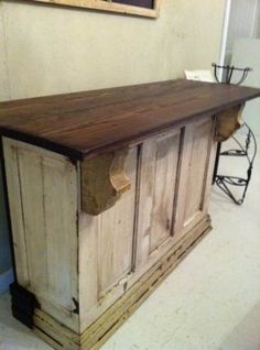 an old wooden bar made from old doors and make it look like something out of wood