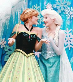 two frozen princesses standing next to each other