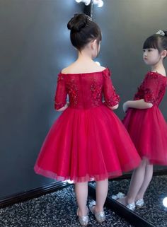 Introducing our exquisite Red Tulle Flower Girl Dress, designed to captivate with its elegant charm and impeccable style. Perfectly tailored for young girls, this medium-length dress features a timeless ball gown silhouette that exudes grace and sophistication.Crafted from a blend of high-quality cotton and polyester materials, this dress ensures comfort and durability for your little one throughout the day. The half sleeves add a touch of playfulness while the solid pattern and chic applications offer a classic yet modern look.Whether it's a special occasion or a formal event, this dress fits true to size, guaranteeing a perfect fit every time. With its shoulder-free collar and sporty flair, it strikes the balance between fashion-forward design and effortless wearability.Elevate your chil Red Princess Dress For Formal Occasions, Elegant Red Princess Dress For Formal Occasions, Elegant Red Princess Dress For Dress-up, Elegant Red Princess Dress For Pageants, Elegant Red Princess Dress For Pageant, Unique Baby Items, Baby Development Toys, Red Flower Girl Dresses, Gown Silhouette