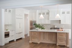 the kitchen is clean and ready for us to use it's white cabinetry