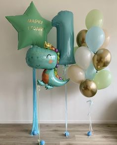 balloons and heliums are arranged in the shape of an animal with a number one on it