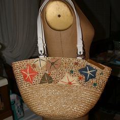 Wonderful Detail On This Straw Bag From Straw Studios. Shows Embroidered Flowers And Lots Of Beaded Detail. Has A White Cotton Lining With Drawstring Closure. Has 1 Zippered Pocket On The Inside And The Zipper Is A Little Sticky At Times. Measures Approximately 15 1/2" Across, 10 1/2" Tall And 5" Wide. Beaded Cream Bag For The Beach, Embroidered White Shoulder Bag For Vacation, White Embroidered Shoulder Bag For Vacation, Summer Embellished Bags For Everyday Use, White Beaded Bags For Summer, White Embroidered Beach Bag, Embellished Everyday Summer Bags, Embellished Everyday Bags For Summer, White Beaded Summer Bags