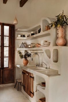 the kitchen is clean and ready for us to use it's natural wood accents