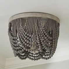 a chandelier hanging from the ceiling in a room