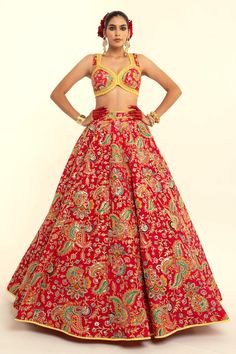 Red sleeveless blouse with paisley printed thread and lace border embroidery. Paired with coordinating lehenga and yellow embroidered dupatta. - Aza Fashions Red Brocade Sets With Intricate Embroidery, Red Brocade Set With Intricate Embroidery, Designer Red Dresses With Motifs, Red Fitted Sleeveless Lehenga, Red Sleeveless Sets With Floral Embroidery, Red Fitted Sleeveless Choli, Red Sleeveless Lehenga With Zari Work, Red Lehenga For Navratri, Fitted Sleeveless Traditional Wear With Intricate Embroidery