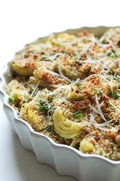 a casserole dish filled with pasta and cheese