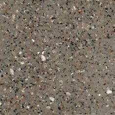 an asphalt surface with small rocks and pebbles