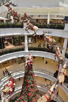 the christmas tree is decorated with santa's sleighs