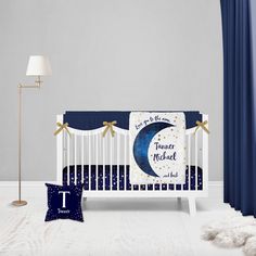 a baby crib with a blue and white theme