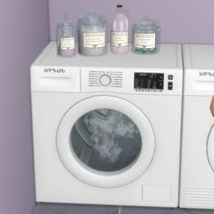 a person holding a washing machine in front of a washer with soaps on it