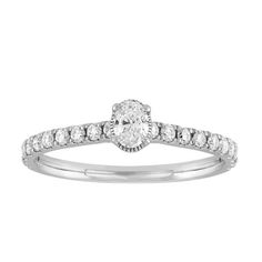 Make a proposal special and memorable with this diamond oval shape solitaire style ring created in 10K White Gold. Crafted in a shiny finish, this ring contains an oval shape diamond in the center and is complemented with small round diamonds cascading down both sides. This diamond ring contains a total of 21 diamonds and has a total carat weight of 1/2 cttw. The diamonds are securely set in a prong setting. Perfect for engagements. Ladies diamond rings. Engagement rings. Solitaire rings. Foreve Diamond Oval Engagement Ring, Engagement Rings Solitaire, Diamond Rings Engagement, Rings Solitaire, Oval Engagement Ring, Solitaire Rings, Oval Diamond Engagement Ring, Gold G, Oval Engagement