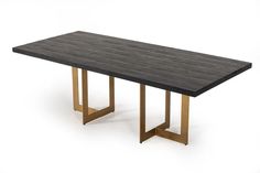 a black table with gold legs on a white background