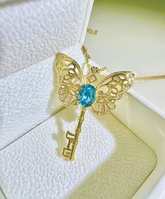 ･ﾟ✧ Key To Butterfly Dreamland Inspired by the whimsical charm of fairy tales and the delicate beauty of butterflies, this necklace combines the butterfly and key motifs.  At the heart of the butterfly lies a genuine blue Swarovski crystal (8mm), radiating brilliance and adding a touch of luxury. The butterfly sits atop a vintage-style key, symbolizing mystery and wonder. This delicate necklace is designed for women who cherish romantic jewelry and intricate designs. The necklace is perfect for Fairycore Butterfly Necklace As A Gift, Fairycore Butterfly Necklace For Gift, Fairy Style Jewelry With Butterfly Charm For Gift, Fairycore Jewelry With Butterfly Charm For Gifts, Fairycore Butterfly Charm Necklace For Gift, Elegant Blue Necklace With Butterfly Charm, Fairycore Butterfly Charm Necklace Gift, Elegant Gemstone Butterfly Necklace, Luxury Blue Butterfly-shaped Jewelry