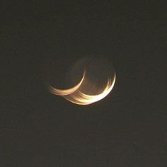 two crescents are seen in the night sky