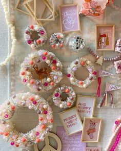 a table topped with lots of different types of crafts and pictures on top of it