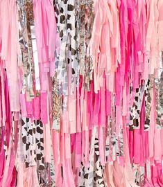 pink and white streamers hanging from the ceiling