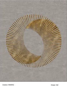 an art work with gold lines in the shape of a circle on a gray background