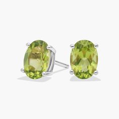 Pop on a pair of these classic oval cut peridot stud earrings to add color to any outfit. With handcrafted 14k gold settings, these oval peridot studs are as durable as they are stylish. Peridot Earrings Studs, Peridot Earrings, Precious Gemstones Jewelry, Earrings Studs, Semi Precious Gemstones, Oval Cut, Gemstone Earrings, Types Of Metal, Birthstone