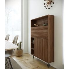 a wooden cabinet sitting in the corner of a room