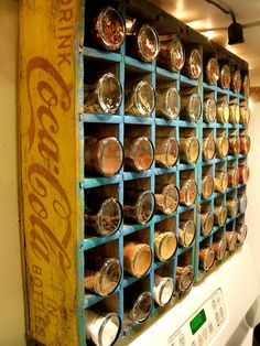 an old fashioned oven with many jars on it