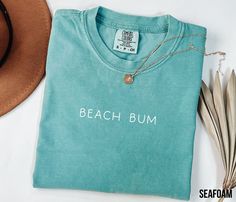 Beach Bum Shirt, Retro Comfort Colors T-Shirt, Trendy Beach Shirts for Women, Summer Vacation Shirts, Womens Oversized Beach Shirt HOW TO ORDER 1. Check and review all photos (including colors and sizes) 2. Select Your tshirt size and t-shirt color from drop down menu 3. Select quantity 4. Click ADD TO CART. For multiple items go back and repeat. IF THE ITEM HAS CUSTOMIZATION Make sure to specify in the customization box what you'd like. The more detail the better! GROUP LISTINGS If its a group Beach Themed Shirts, Beach Shirts Vinyl, Trendy Beach, Beach Color, Beach Shirt, Vacation Shirts, Beach Bum, Shirts For Women, Beach Shirts