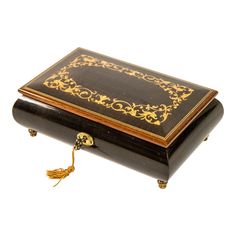 an ornate wooden box with gold trimming