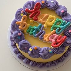 a birthday cake with the words happy birthday spelled out on it's icing