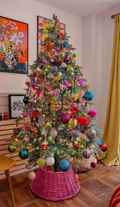 a brightly colored christmas tree in a living room