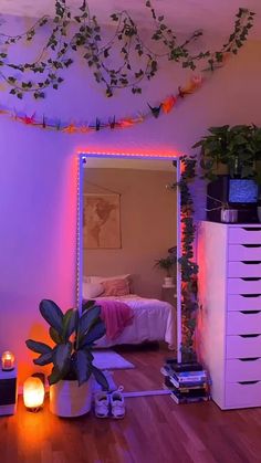 the room is decorated with plants and candles