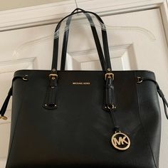 Black Leather Michael Kors Tote With Gold Hardware. This Bag Was Purchased New And Never Used. Zipper Closure. Inside Has A Zippered Section That Separates The Bag Into Two Sides. Additional Pockets On Both Interior Sides. Bottom Of The Bag Measures 13 In X 5 In. Bag Is 11 In Tall. Cheap Michael Kors Rectangular Shoulder Bag, Michael Kors Soft Leather Bags For Office, Michael Kors Black Shoulder Bag With Leather Handles, Michael Kors Black Bag With Leather Handles, Black Michael Kors Bag For Office, Classic Black Handbag, Black Tote Purse, Michael Kors Bag Black, Micheal Kors Handbag