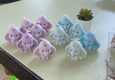 there are many small elephants on the table