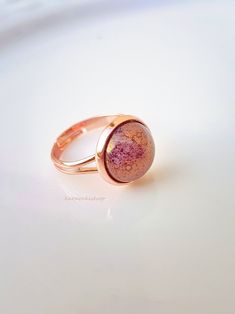 Adjustable light purple marble ring gift for her This beautiful ring is made of 12mm rose gold ring setting and a gorgeous 12mm light purple marble glass dome. NOTE: Ring is water resistant but should not be worn while hand washing, bathing or swimming. Jewelry comes as a gift in a gift box. Thank you so much for visiting : ) Swimming Jewelry, Oval Rose Quartz Rings As Gift, Round Purple Rose Quartz Jewelry, Purple Rose Quartz Round Jewelry, Pink Multi-stone Amethyst Ring Gift, Marble Ring, Marble Rings, Rose Gold Ring Set, Romantic Rings