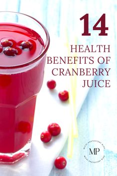 a glass filled with cranberry juice on top of a table