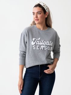 Creatures of comfort, rejoice! Whether you’re watching the game from home or out tailgating with the team, you will appreciate the snug and soft sports themed sweatshirts from Shiraleah. The grey colored "Tailgate Season" Sweatshirt is made from a lightweight cotton blend with bold white and black outlined sherpa letters. Its classic round neck and banded hems make it the perfect casual fit and your ultimate sports celebration apparel. Pair with other items from Shiraleah’s Gameday Collection to Gray Sweatshirt For Game Day In Fall, Gray Sweatshirt For Game Day In Winter, Gray Winter Sweatshirt For Game Day, Athletic Heather Fan Apparel Sweatshirt For Fall, Heather Grey College Sweatshirt For Fall, Heather Grey Fall Sweatshirt For College, Gray Fan Apparel Sweatshirt For Sports Season, Collegiate Athletic Heather Sweatshirt For Fall, Casual Gray Sweatshirt For Game Day