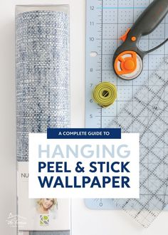 the complete guide to hanging peel and stick wallpaper with scissors, tape, measuring rulers and other crafting supplies