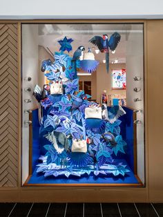 a display case with blue and white items in it